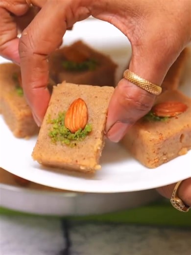 ✨ Badam Pak Recipe | Instant 3-Ingredient Almond Diwali Sweet! 😍⭐ ✅ Save now, try later! ✨ Try this super simple & healthy Homemade Recipe today 👩‍🍳 Ingredients Badam (Almonds): 1 cup Ghee: 4 tbsp Sooji (Rava): 1 cup Paneer (Indian Cottage Cheese): 1 cup Sugar: 3/4 cup Milk: 1/2 cup Cardamom Powder: 1 tsp Pista (Pistachio) & Badam (Almonds) – for garnish Method Grind almonds using pulse mode to make a fine powder. Heat ghee in a pan, add sooji and roast on low–medium flame till light golden. 