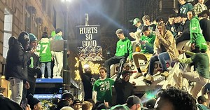 VIDEO: Philadelphia Eagles fans climb police van, light poles, launch fireworks in street after Super Bowl win