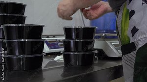 packing foods in a disposable container in a Korean restaurant
