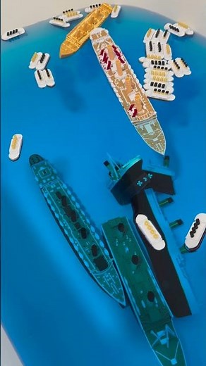 Britannic submersible model sinking between other ships
