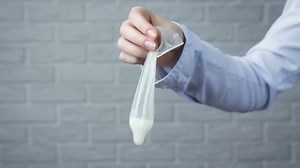 clip-1046810764-girl-holding-used-condom