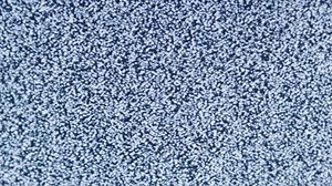 distorted white static noise interference on a small portable analog TV with a cathode ray tube, full frame real time