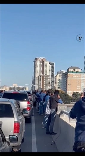 Bystander Video Captures Small Plane Making Emergency Water Landing Near Chicago as Crowd Watches Video recorded near Chicago shows a dramatic aviation emergency as a small airplane is forced to make an emergency water landing just outside the city. The footage captures the aircraft descending low over the water before touching down and skimming across the surface, sending up large sprays as it slows. Multiple people standing on a nearby bridge can be seen watching the scene unfold, many holding