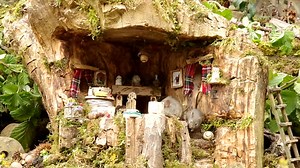 busy day in the little mouse house . lots of nibbling to do and things to explore . | George the Mouse in a log pile house