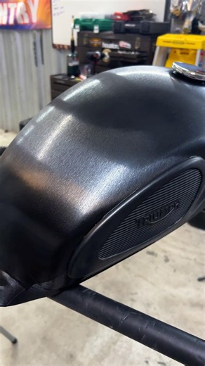 Motorcycle tank wrapped in 3M black brushed metal