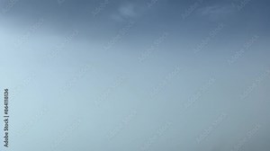 Flying over a layer of fluffy stratus clouds. Immersive pilot perspective from an airplane cockpit. 4K 60FPS