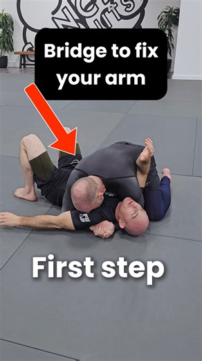 🛡️ Bottom Side Control Escape: Get That Frame In! 🛡️ Professor Brian shows how to sneak your near-side arm inside for a frame when it's tough in bottom side control—bridge smart: 1️⃣ Bridge Toward Opponent – Drive a strong bridge directly into their direction to create space. 2️⃣ Palm Facing Ceiling – Position the arm you're inserting with the palm up for easier entry. 3️⃣ Drop and Insert – As you come back down from the bridge, slide the arm inside smoothly. 4️⃣ Frame on Hip – Secure the fram