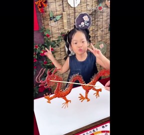 Traditional ancient Chinese craft brings a dragon and fish to life