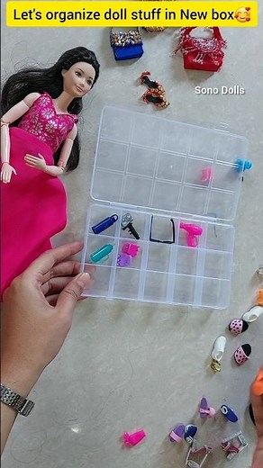 organize barbie doll items in New box