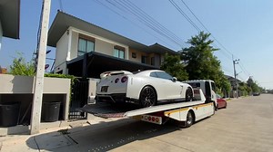 Nissan GT-R Towed on Flatbed Tow Truck