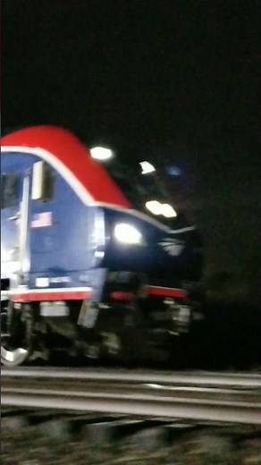 Amtrak Floridian speeds past, FRA car on the rear...