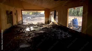 An abandoned building covered by volcanic lahar after Calbuco Volcano eruption.