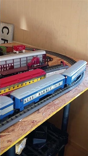 blue train taking passenger to the station