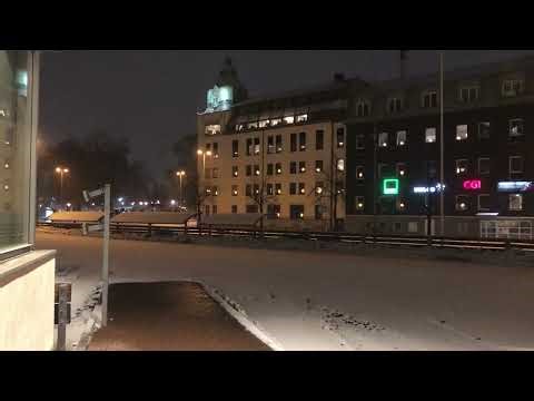 Winter Night at Jönköping Travel Center, Sweden: Snowy Bus Station Atmosphere