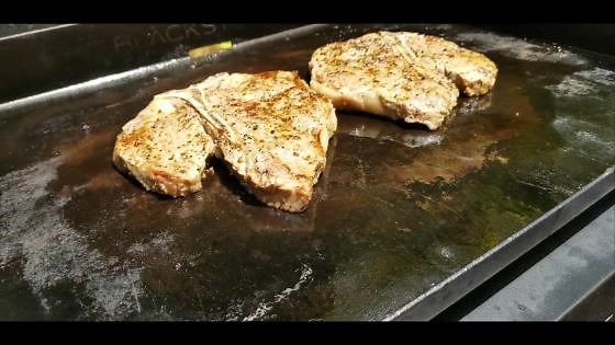 Cooking porterhouse steaks to honor cancer fighters and survivors