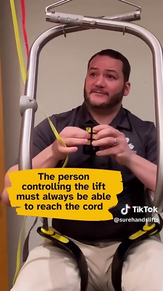 One safety feature on the SureHands lift is the ability to manually lower in the event that the batteries or remote aren’t operating. 💡Thanks to Joe for the demo! Learn more at SureHands.com VD: video shows SureHands rep demonstrating how pulling the yellow cord allows him to lower down to the ground. Voiceover and captions say: Yellow Cord = Safety Down. If the batteries or remote are not working, the lift user can be lowered manually. A steady pull of the yellow cord provides a complete and s