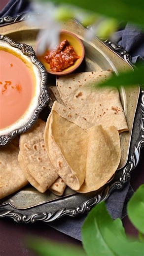 Binjal Pandya | Food Photographer and Videographer on Instagram: "Comment “Recipe “ for Gujarati Padwali Rotli means two layered roti, it is a delightful twist on the traditional Gujarati flatbread, alternatively referred to as Dupadi, Dosti, Dopadi, or Bepadi Roti. This Layered Roti has gained immense popularity in the state of Gujarat, particularly during the scorching summer months. It is commonly enjoyed alongside a serving of delectable Aamras. . . , . . ."