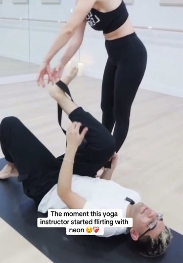 Flirting with Neon: A Yoga Instructor's Playful Moment