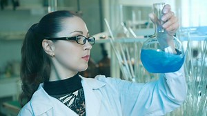 Chemistry shaking a laboratory flask - Free Stock Video