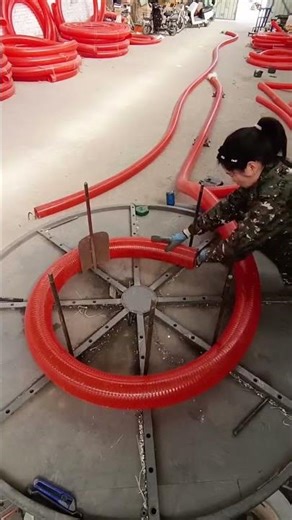Manual coiling process of steel wire hose