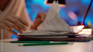 Workaholic woman sitting at office desk signing paper sheets in stack of colorful file paper folders with pencil, close up. Bureaucracy business concept. Stock Video