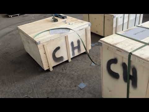 Close-up of wooden box packing tape being pulled tight