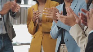 Download A group of people clapping together for free