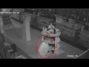 Surveillance video shows barefoot child break into smoke shop