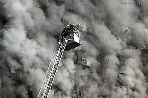 Dozens of Iran firefighters feared trapped in building collapse