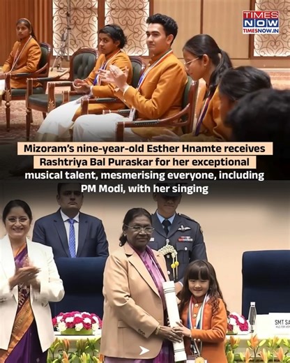 Nine-year-old singing prodigy Esther Hnamte from Mizoram received the Pradhan Mantri Rashtriya Bal Puraskar 2025 in the Art and Culture category for her exceptional musical talent. Presented by President Droupadi Murmu on Veer Bal Diwas in New Delhi, the honour recognises her soulful renditions, including Vande Mataram, which have earned praise from PM Modi and A.R. Rahman. #PMModi #TimesNow | TIMES NOW