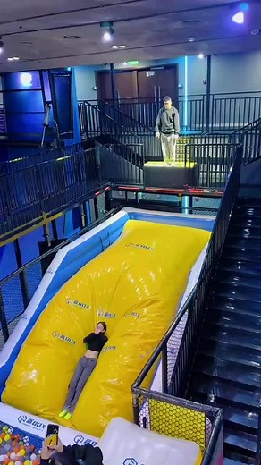 Indoor Fun: Sliding into a Colorful Ball Pit