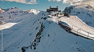 Cog railway train ride to the Gornergrat Observation Platform in Zermatt. Observation deck in Zermatt, Switzerland during snow in winter time.