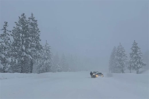 Motorists hampered by heavy snow along Interstate 80 in the Sierra Nevada mountains