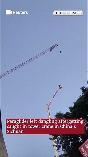 Paraglider left dangling after getting caught in tower crane in China's Sichuan