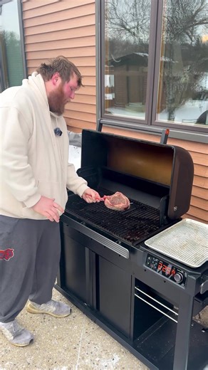 Cooking a beautiful tomahawk steak in the snow - outdoor grilling