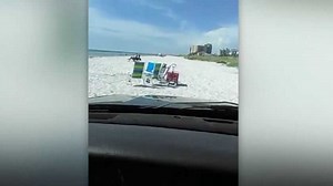 'We're flying, brah!' Man livestreams beach chase