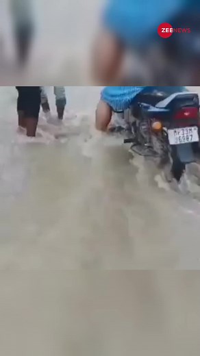 266K views · 665 reactions | Bike washed away in river while crossing flooded bridge #Viral #Video #Trend #Monsoon #Flood | Zee News English | Facebook