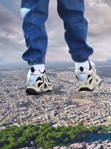 Giant boy stepping on city