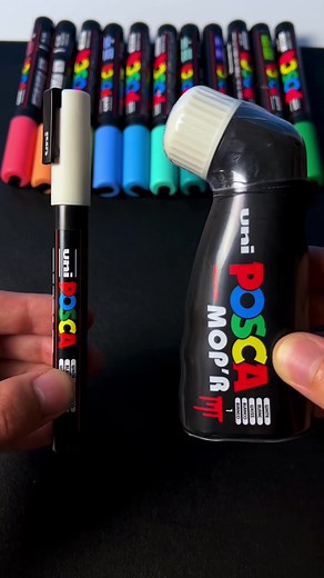 White Posca Marker Drawing on Black Sketchbook