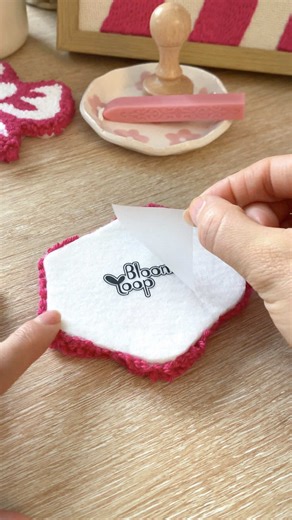 The best feeling in the world: packing your orders with so much love! ✨🧶 I’m so emotional right now seeing these first 3 pieces ready to ship to their new homes. Every stitch and every detail was made with you in mind. A huge THANK YOU to my first customers for supporting my dream. You guys are making Bloom Loop Studio come to life! 💖 🛒 Shop the collection via the link in my bio! Do you like the packaging with me? Let me know! 📦🥰 #punchneedle #slowmade #codyhome #diycosy #satysfyingvideo