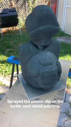 This is a view of the turtle after it was sprayed with a combination of black and Camo Plasti Dip, the black covering the Sharpie marks and, giving the green base for the accent colours. | Vinland Puppet Project | Facebook