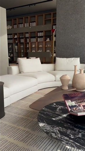 A living space defined by softness, scale, and architectural rhythm.