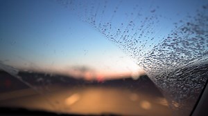 Download View in windshield car driving fast on the highway in the dark under the headlights. Travel and trip concept. for free