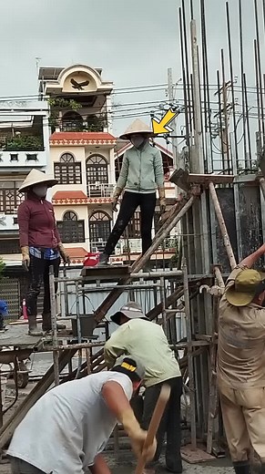 Construction Workers at Urban Building Site
