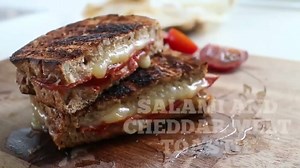kitchen hack! you can use your bread toaster to make any cheesy sandwich you want. you can even reheat pizza slices! the trick is to use a toaster bag. you can easily make one with baking paper. just a word of caution tho: paper may burn so you gotta eagle-eye the whole process so you dont burn your house down. made a salami, tomato and cheddar melt toastie with fresh ingredients from Little Farms, my new fav premium grocer. assemble the sandwich and build a toast bag around it. pop into toaster