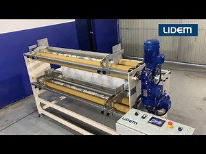 Double fabric rewinding machine, winding from one roll into two