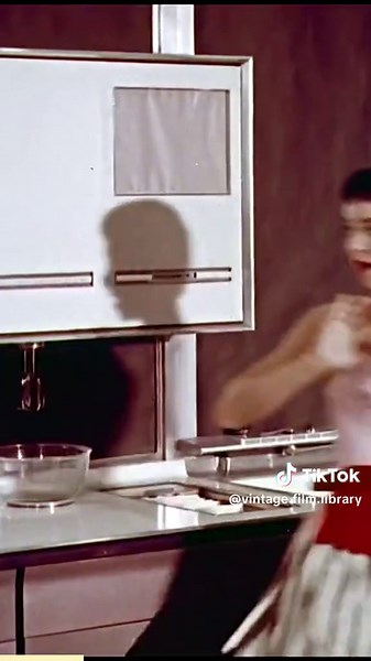 🚀 The Kitchen of Tomorrow… as imagined in 1956! 🍰✨ This retro-futuristic scene comes from Design for Dreaming, a surreal General Motors Motorama film that envisioned the kitchens and cars of the future. In this clip, dancer Tad Tadlock plays a woman who dreams of a world where cooking is effortless—just slide in a recipe card, and the kitchen does the rest! From a rotating, glass-enclosed fridge to a push-button baking system, this 1950s vision of the future is both whimsical and fascinating. 