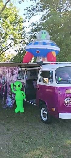 Aliens in Flying Saucers beaming up a Volksvagon Bus Van because even Aliens have taste.
