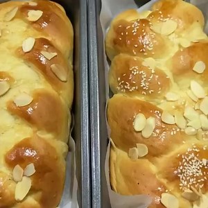 Greek Easter Bread! Sweet yeast bread that is a bit brioche-like. You'll love this traditional dense braided loaf that's adorned with red-dyed eggs. You can serve it as part for brunch with a little honey and feta, or as part of your dinner feast next to other favorites like this Greek lamb | Hellenic World