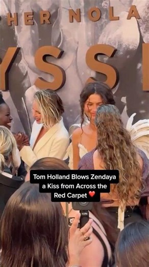Tom Holland Blows Zendaya a Kiss on the Red Carpet